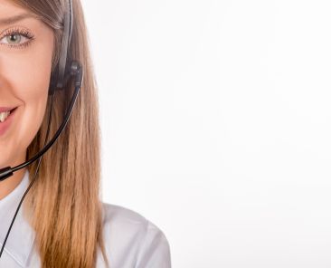 Portrait of happy smiling cheerful support phone operator in headset, isolated on white background Female customer support operator with headset and smiling